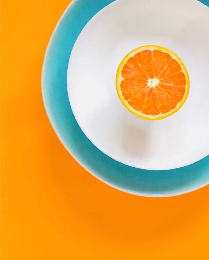 Orange in middle of plate